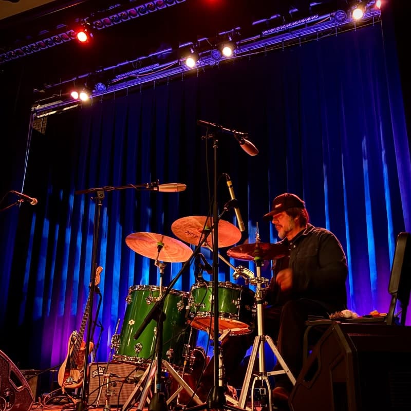 Jeff Berlin posing with drumkit